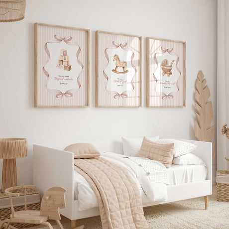 Nursery print set showing a rocking horse, vintage baby pram and alphabet blocks paired with Christian Bible verses