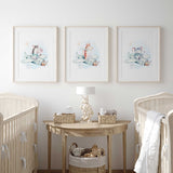 Three safari animal prints showing a zebra, giraffe and elephant in pale mint aeroplanes with blue washes, clouds and stars.
