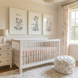 Safari animal nursery wall art set with lion, giraffe and elephant prints, floral details and inspirational quotes for baby girl room decor