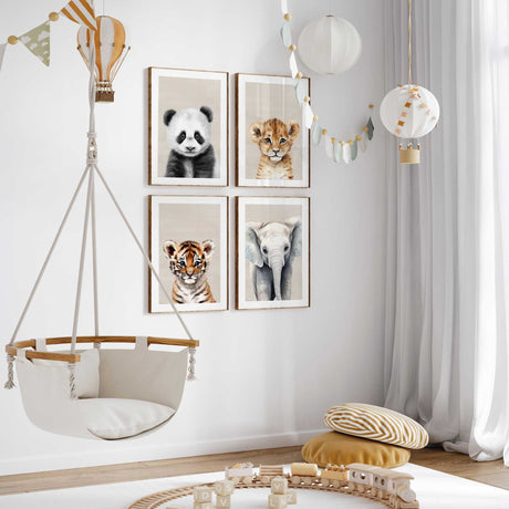 Safari animal nursery wall art set featuring panda, lion cub, tiger and elephant prints in soft neutral tones