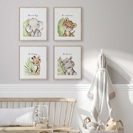 Set of 4 safari animal nursery prints featuring leopard, elephant, hippo, and giraffe with green leaves and motivational quotes for jungle-themed kids décor.