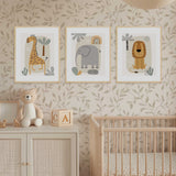 safari nursery wall art set featuring giraffe, elephant and lion prints in warm earthy tones for baby room decor