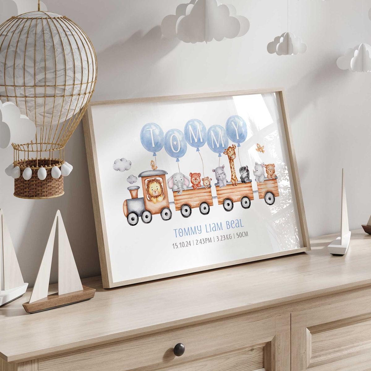 Safari animal train print personalised with blue letter balloons, the child’s full name and birth information