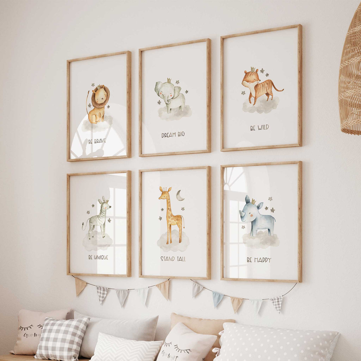 Adorable animal themed nursery decor with watercolor prints of a lion, elephant, tiger, zebra, giraffe, and rhino, each with motivational text.