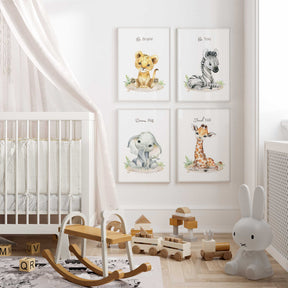 A set of four safari jungle animal prints featuring a lion, elephant, zebra, and giraffe, displayed on a nursery room wall above a wooden crib with toys.