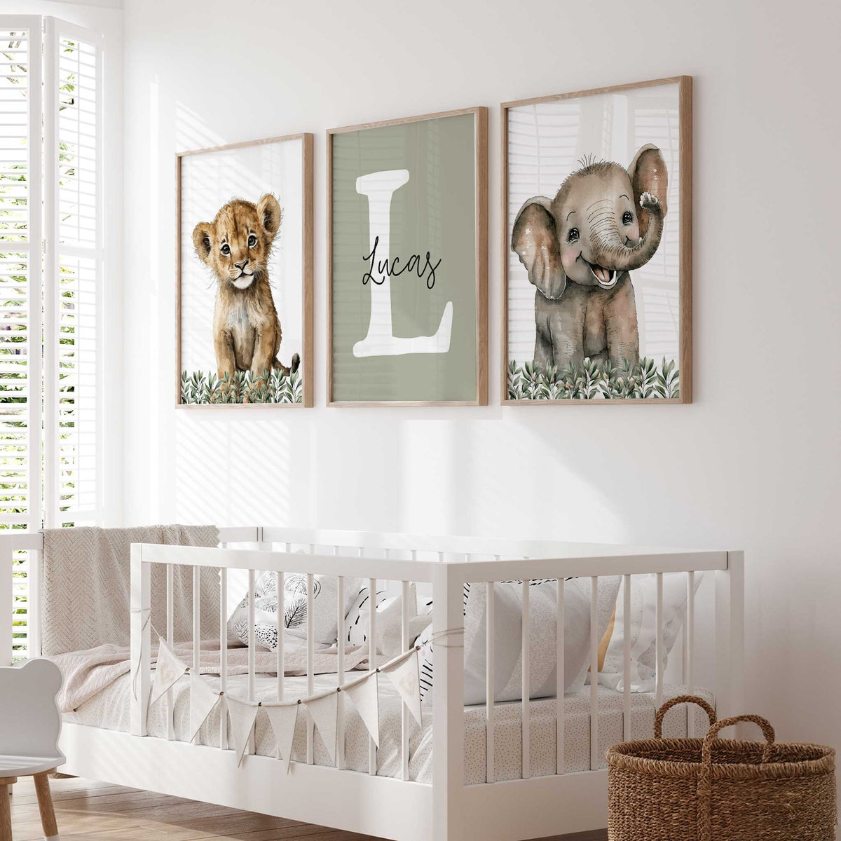 Personalised safari set with baby lion, elephant and a white initial with the kids name on sage green.