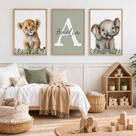 Safari animal trio featuring a lion cub, smiling elephant and white initial with personalised name on a sage green background.