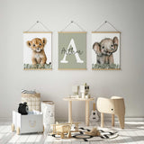 Safari animal trio featuring a lion cub, smiling elephant and white initial with personalised name on a sage green background.