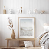 Tranquil beach print featuring sand dunes and seagulls over the sea.