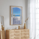 Santorini coastal wall art print featuring traditional white Greek architecture, olive trees and a calm blue sea view