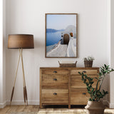 Santorini Greek Island print featuring white architecture and a rustic wooden doorway.