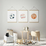 Watercolour soccer ball, baseball and basketball prints with blue-grey, red and orange details on light backgrounds.