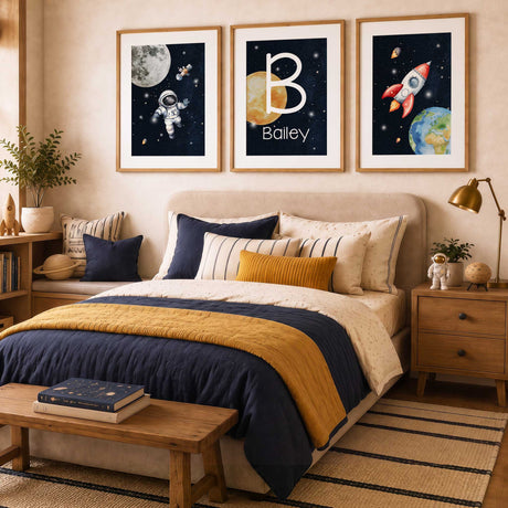 Three framed space prints featuring an astronaut, personalised name and rocket displayed in a boys bedroom