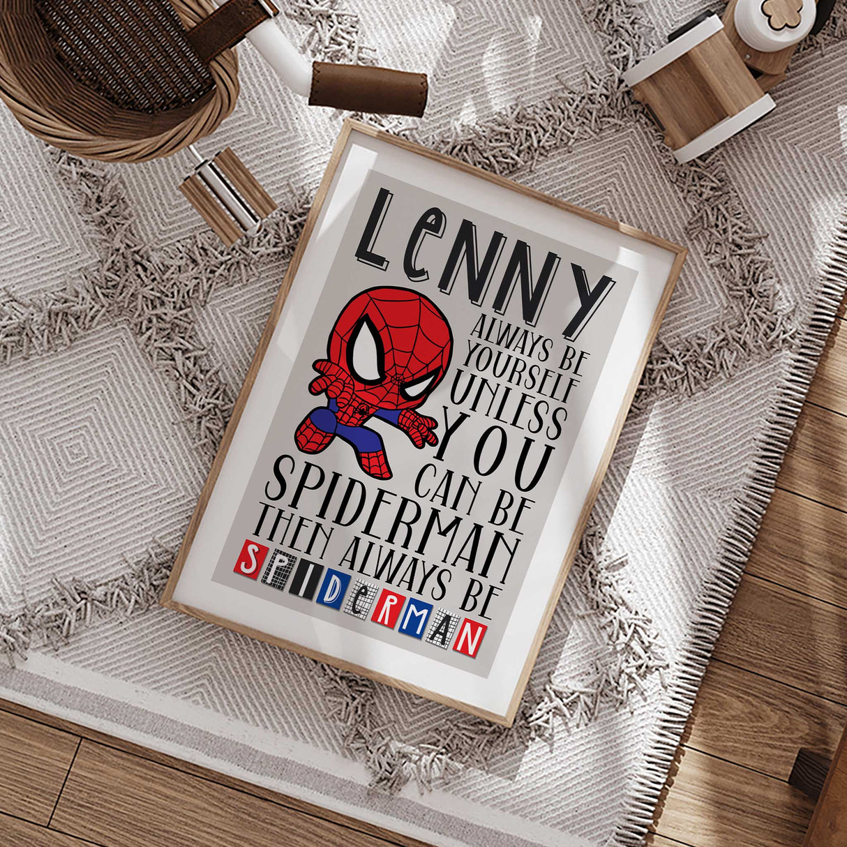 Personalised spiderman wall art print for boys featuring custom name and fun quote on light background with white border edge.
