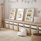 Construction print trio with yellow trucks, tracked diggers, a road roller and a Build Your Dreams tower crane on white