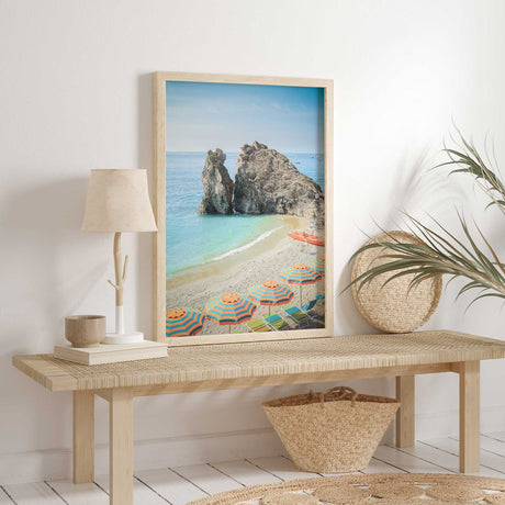 Striped orange and teal umbrellas on a sandy beach