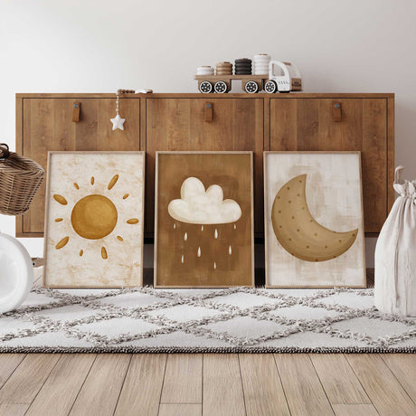 Neutral nursery wall art set with sun, moon, and cloud prints in warm earthy tones for kids’ bedroom décor.