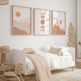Sun, moon phase and mountain wall art set of three in warm terracotta, beige and ochre, with simple abstract shapes.