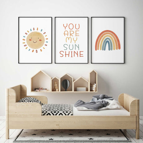 Sunshine-themed print set for babies and toddlers featuring cheerful sun, quote and rainbow in retro colour palette