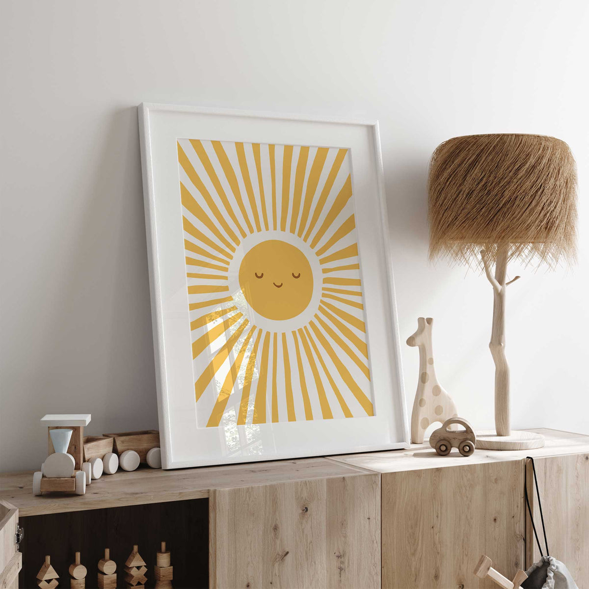 Sunshine art print featuring a round golden yellow sun with closed eyes, a gentle smile and long sunburst rays.