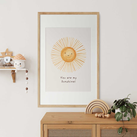 Positive and uplifting nursery wall art with a sun illustration and quote.