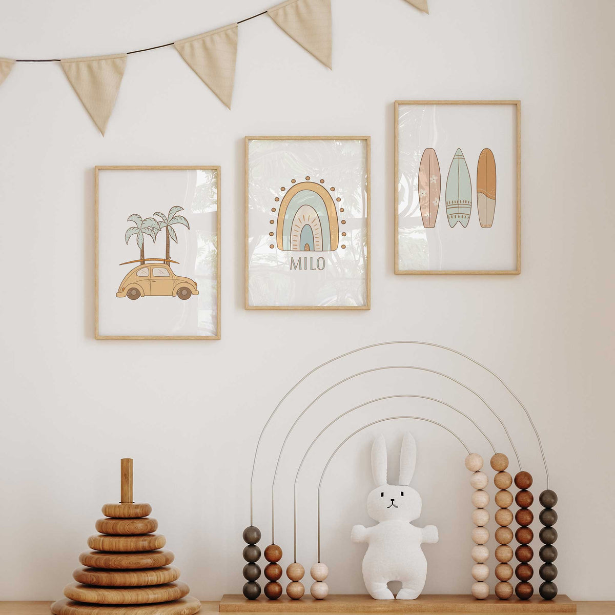 Three surf wall art prints showing a beach car with palm trees, a rainbow named personalised and pastel patterned surfboards.
