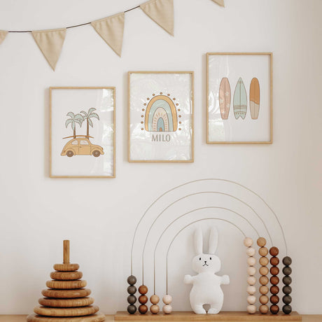 Three surf wall art prints showing a beach car with palm trees, a rainbow named personalised and pastel patterned surfboards.