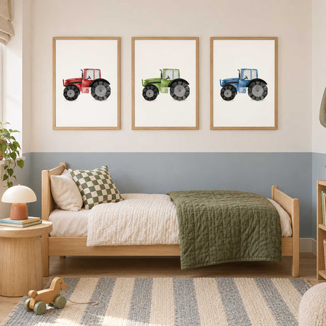 Three watercolour tractor prints in green, red and blue, each with black wheels on a plain white background.