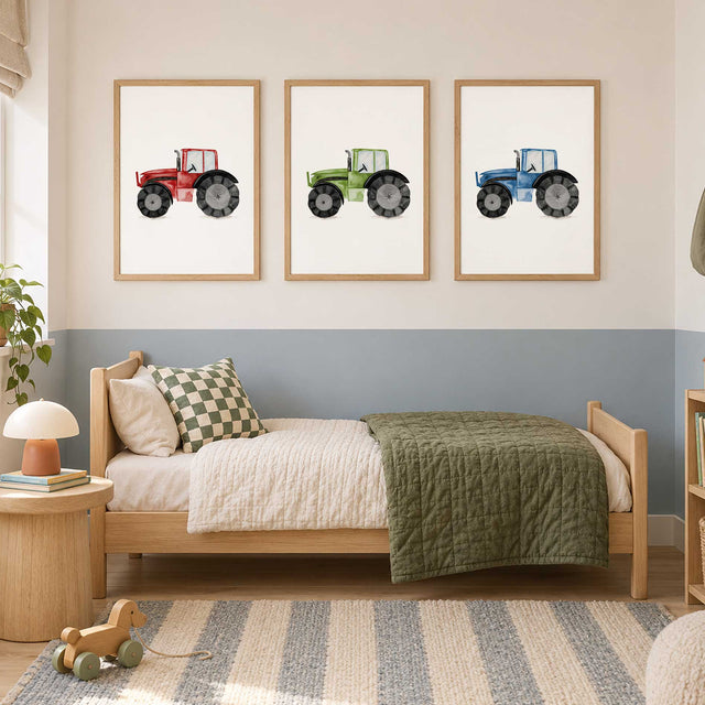Three watercolour tractor prints in green, red and blue, each with black wheels on a plain white background.