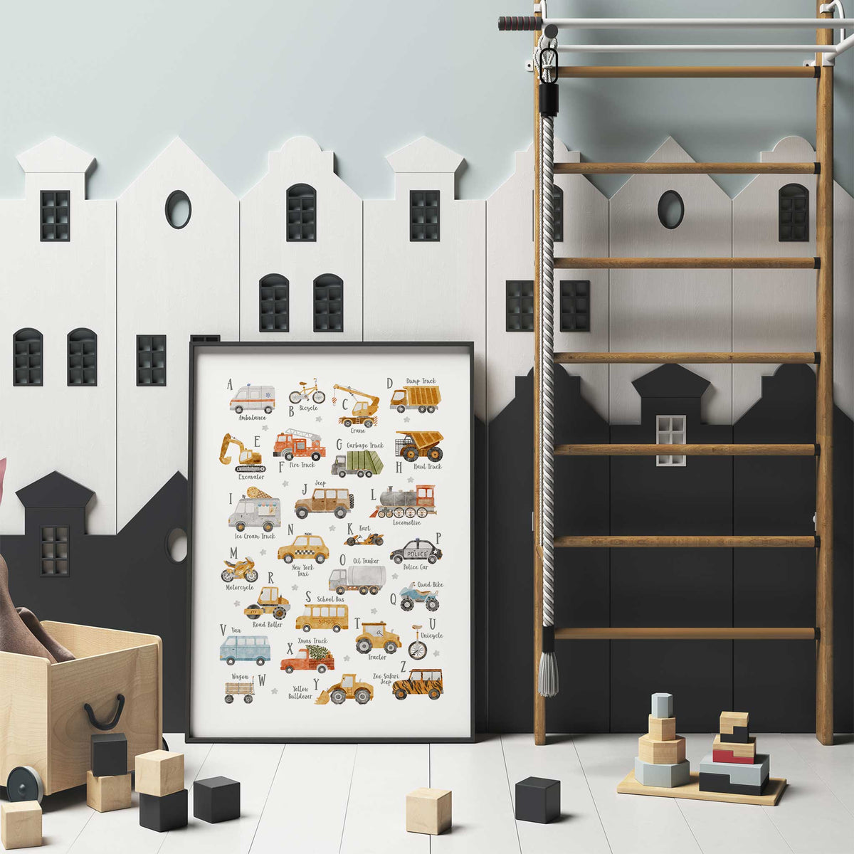Vehicle alphabet artwork with A to Z letters, mustard construction trucks, green rubbish truck and blue van on white.