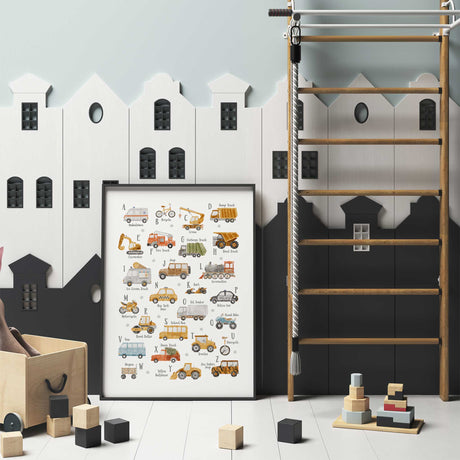 Vehicle alphabet artwork with A to Z letters, mustard construction trucks, green rubbish truck and blue van on white.