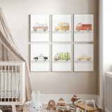 Set of six vehicle themed nursery prints featuring a fire truck, police car, school bus, and more, perfect for boys’ room decor.