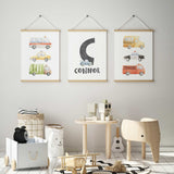 Three vehicle prints with watercolour cars, bus and trucks, and a grey initial, name and blue tow truck.
