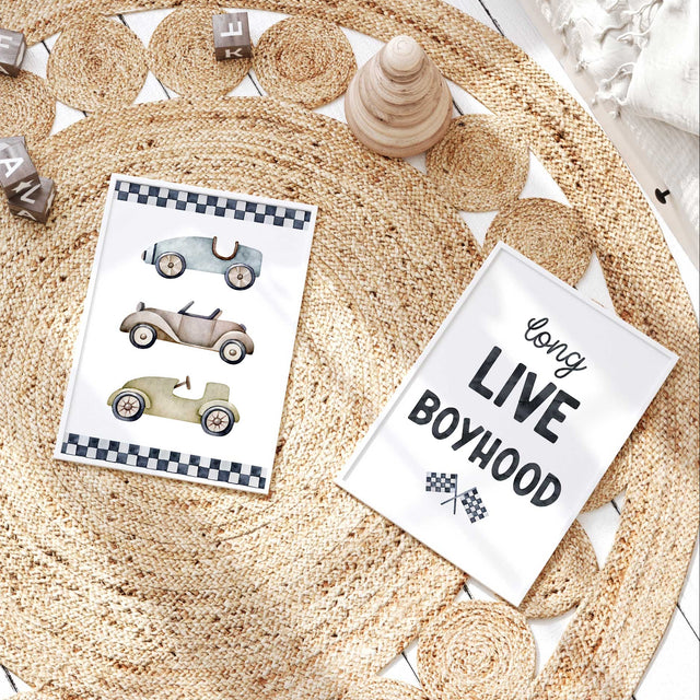 Vintage race car wall art set with three muted cars on one print and Long Live Boyhood lettering with crossed racing flags.