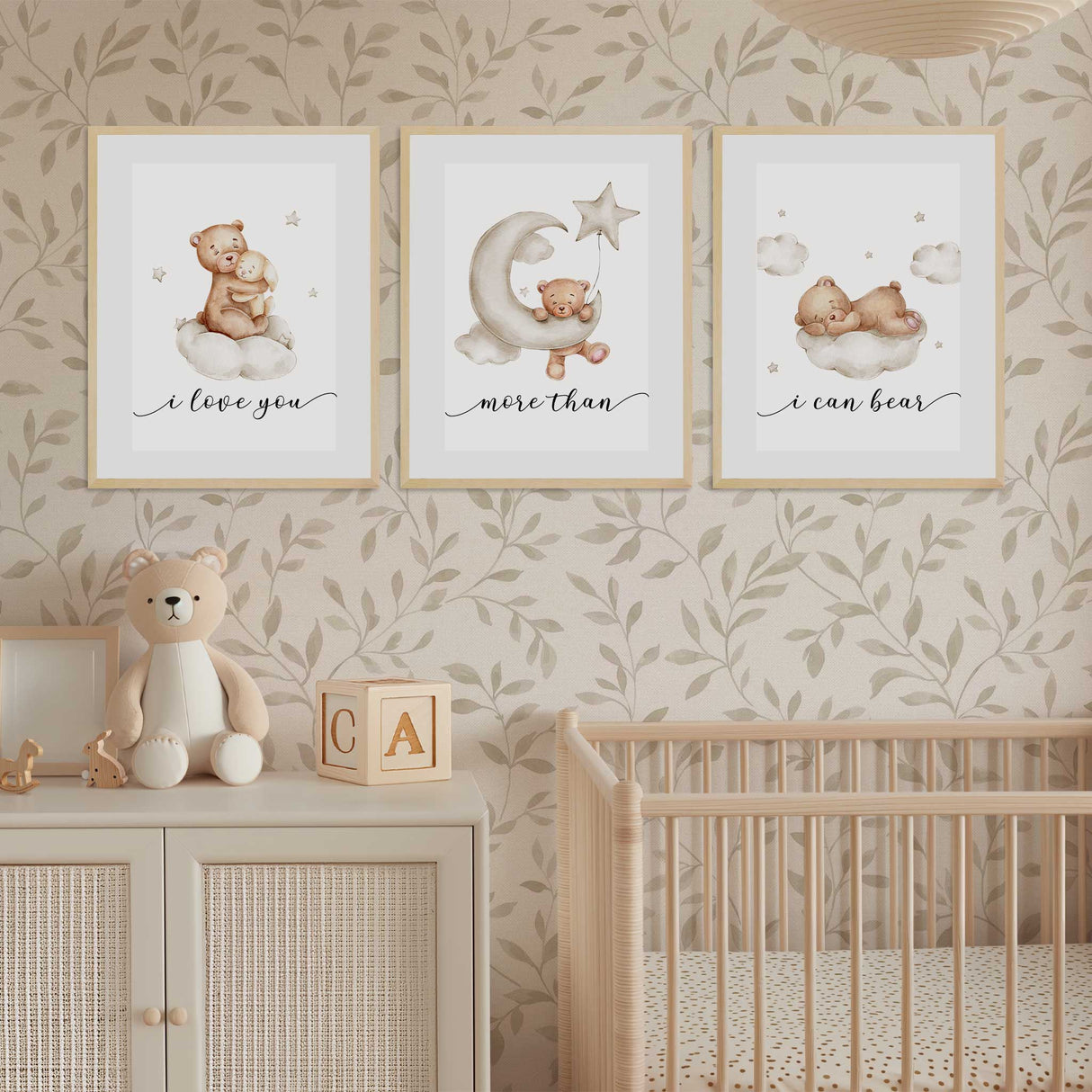 Set of three soft watercolor bear prints spelling out “I love you more than I can bear,” perfect wall art for a calm neutral nursery.