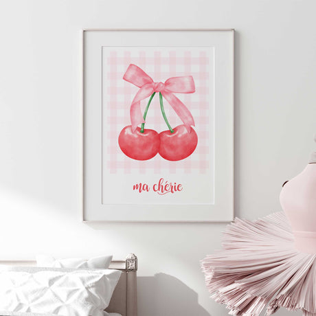 Watercolour-style cherry artwork featuring rich red fruit, a soft pink fabric bow and classic pink checked details.