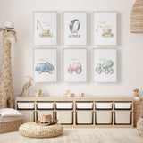 Six multicolour construction prints featuring watercolour vehicles, clouds and a grey intial above the childs name.