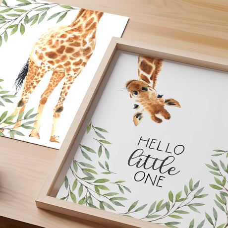 Watercolour giraffe nursery prints featuring two coordinating leafy safari designs