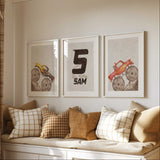 Yellow and red monster truck prints with a personalised initial print, muddy tyres and pale beige textured backgrounds.