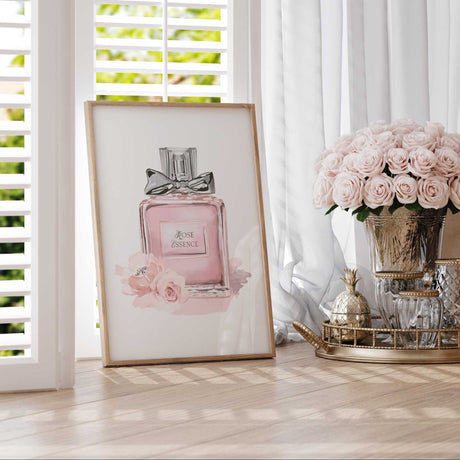 Watercolour-style perfume bottle artwork with pale pink colouring, floral accents and Rosé Essence decorative lettering.