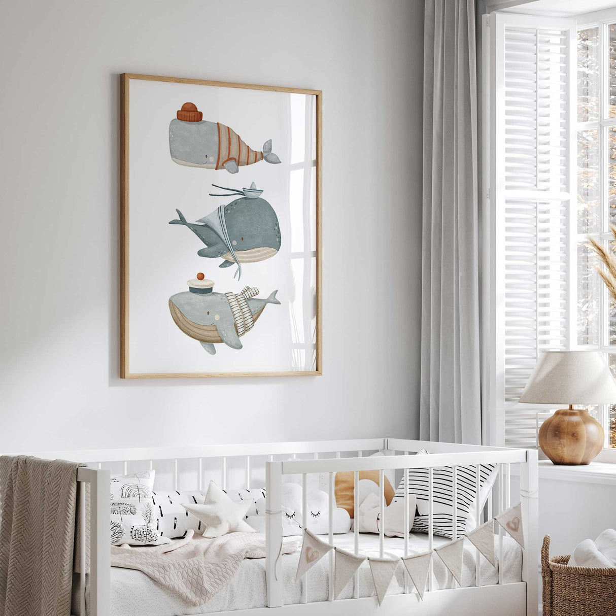 Whale nursery print with charming details: a whale in a red beanie, another in a captain’s hat, and a third in a sailor’s hat, perfect for kids’ room decor.