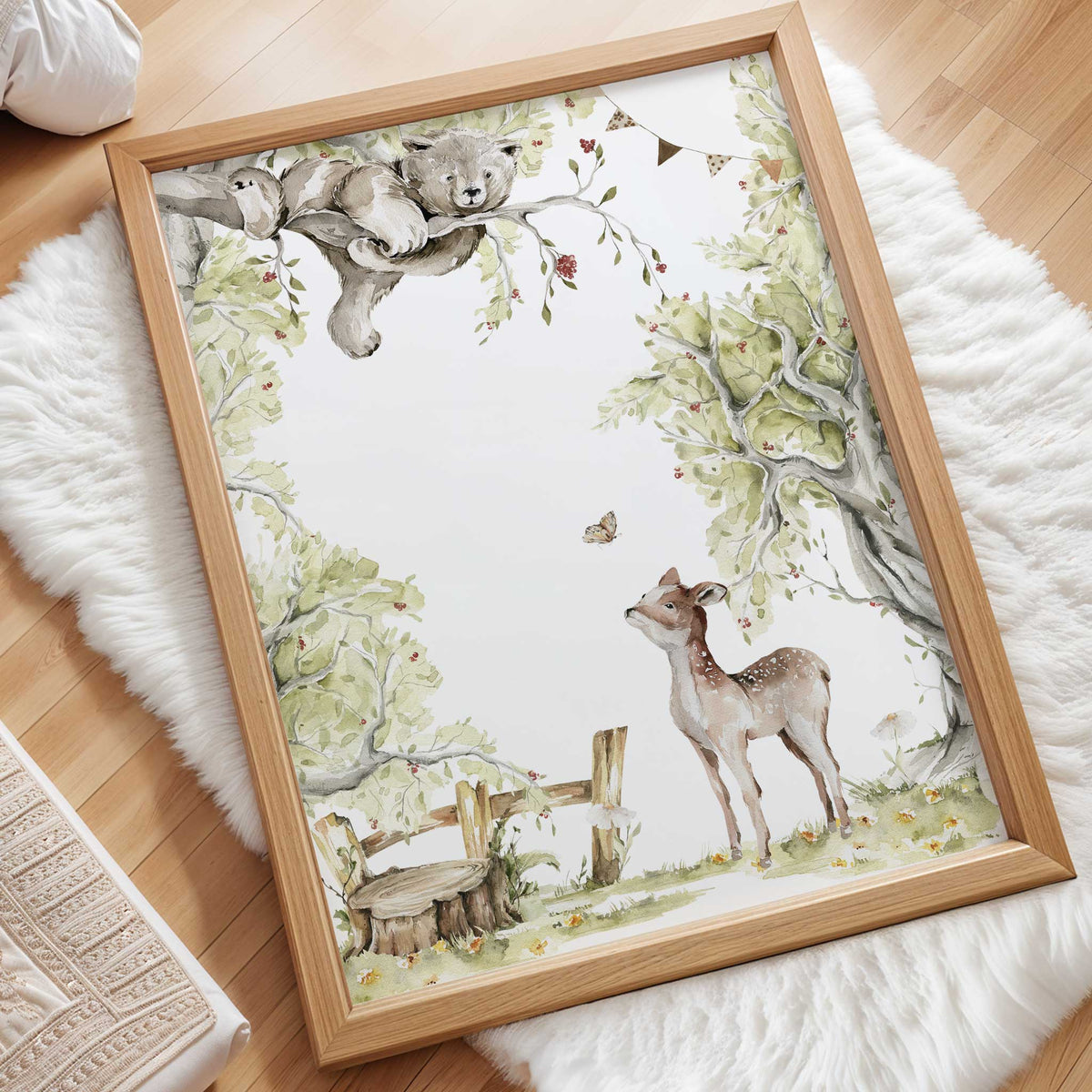 Detail of a fawn beneath a bear in a tree, surrounded by soft green foliage and small woodland flowers