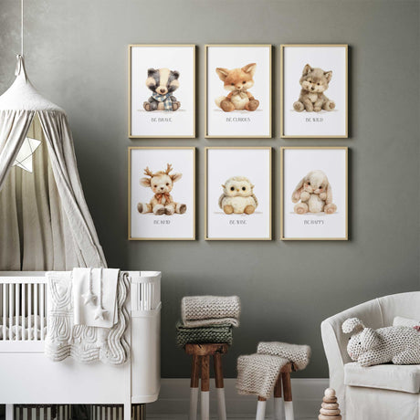 Six coordinated woodland nursery wall art prints featuring bunny badger deer fox owl and wolf illustrations