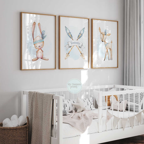 a baby's room with a white crib and three pictures on the wall