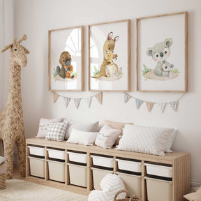 Set of three Australian animal nursery prints featuring platypus, kangaroo, and koala in soft neutral tones for baby room decor.