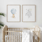 Blue hot air balloon nursery prints with a bear and mouse beside a matching quote.