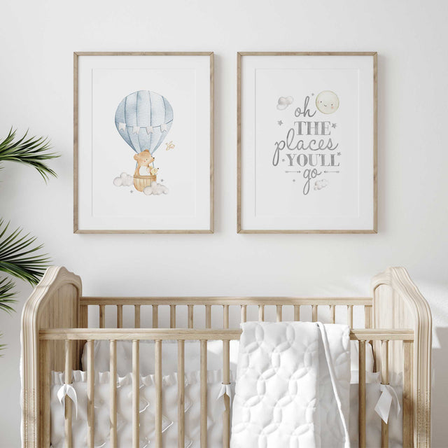 Blue hot air balloon nursery prints with a bear and mouse beside a matching quote.