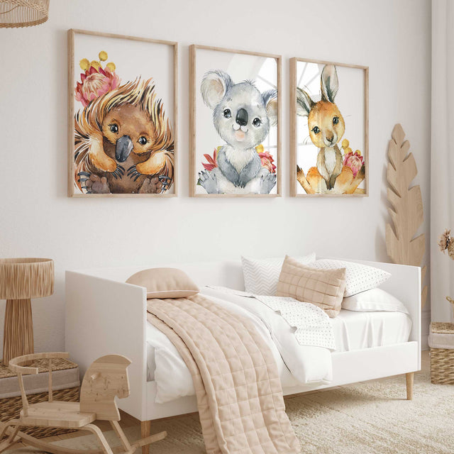 girls australian animal nursery wall art set of 3 featuring echidna koala and kangaroo with native florals.