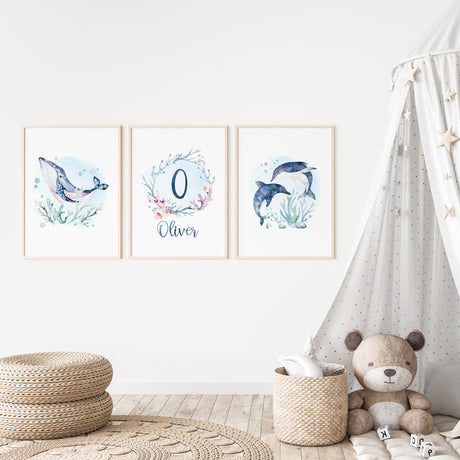 Set of 3 watercolour paintings featuring dolphins, a whale, and seaweed in an underwater theme perfect for nursery
