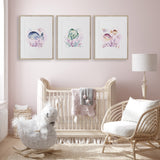 Whale and fish girls nursery prints in pastel pink tones, perfect for ocean-themed bedroom decor.